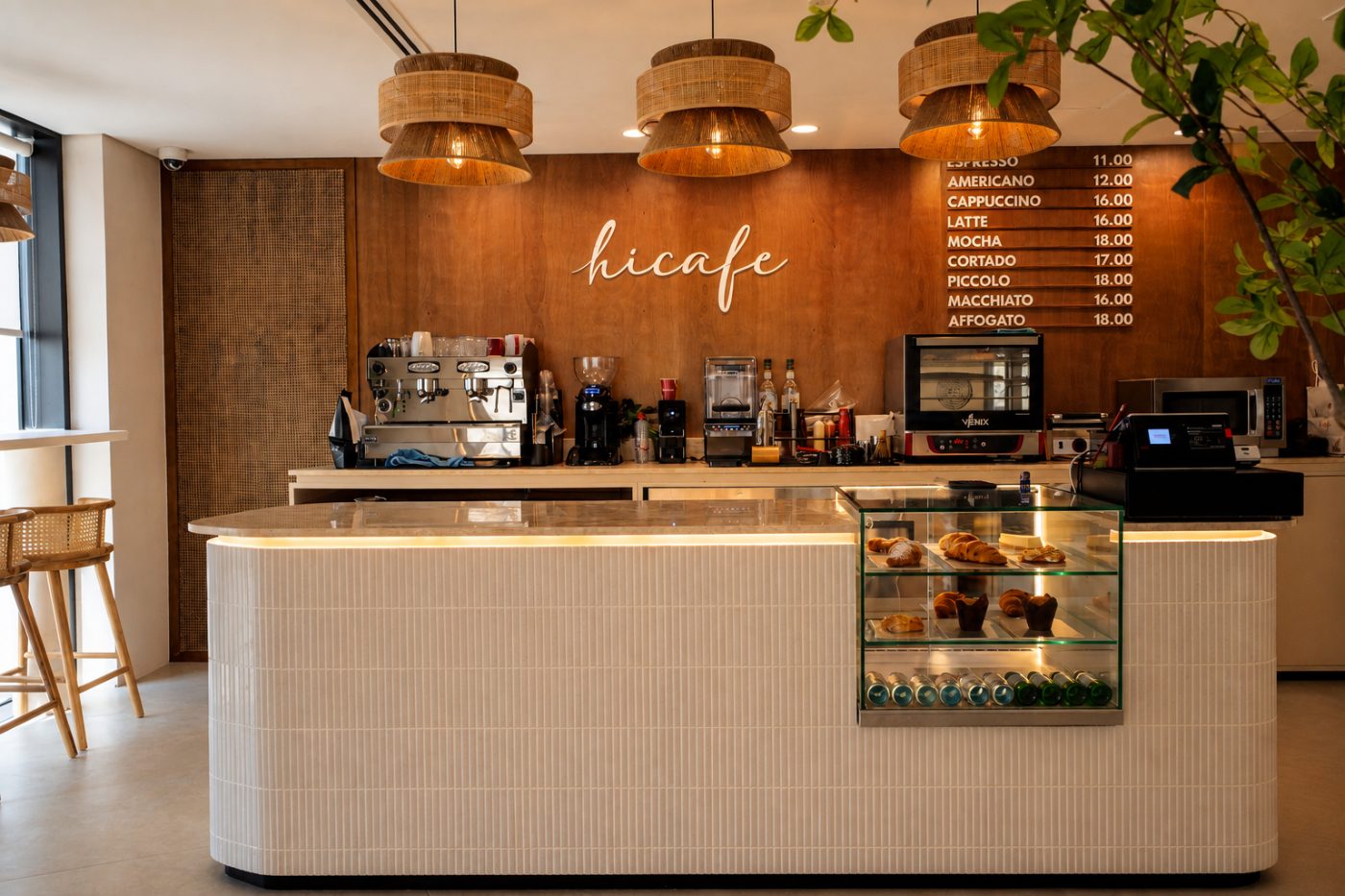 The hicafe counter at HiveOne with barista station and pastry display